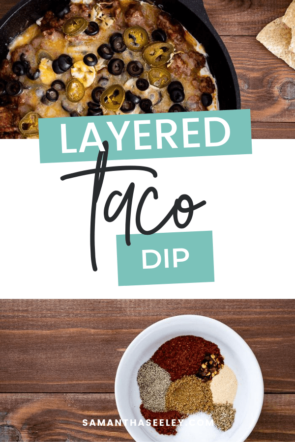 taco layer dip inside cast iron skillet topped with olives and jalapenos