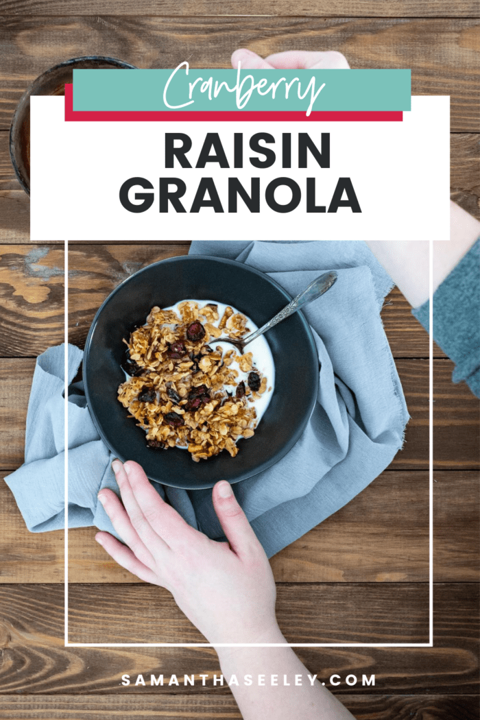 granola in bowl with spoon and hands reaching for honey