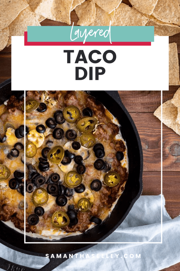 taco dip in cast iron skillet with chips