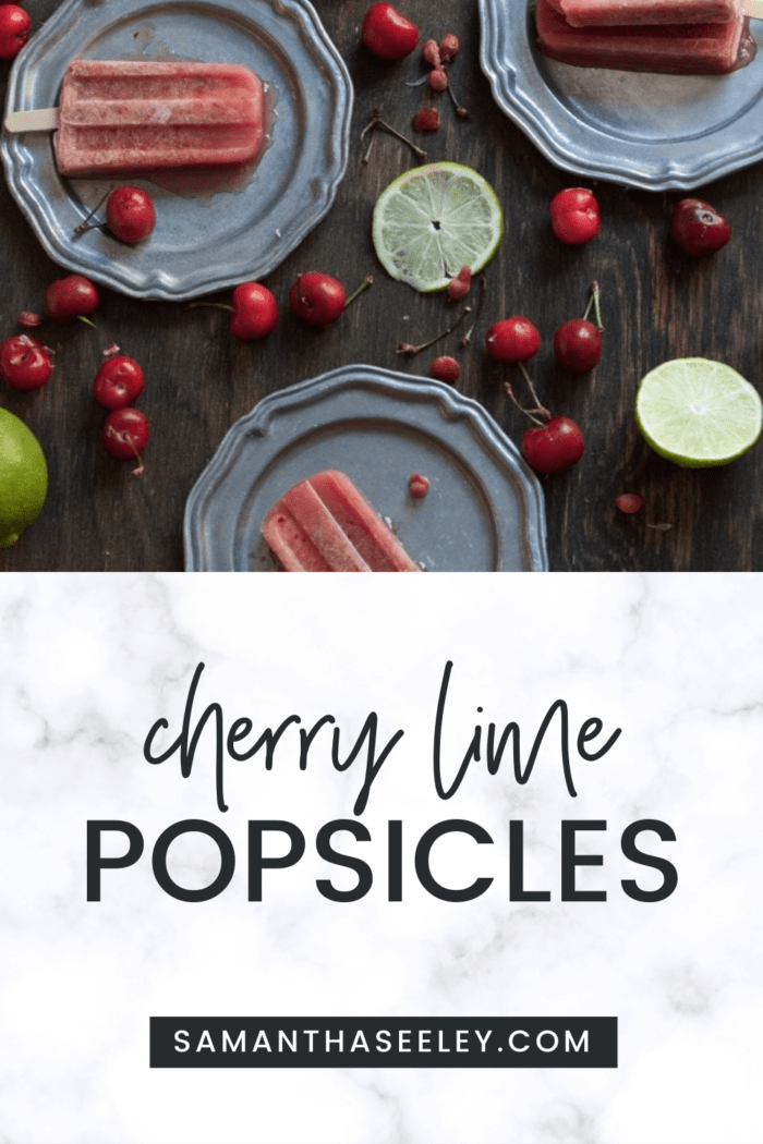 cherry lime popsicles on plates with cherries and limes