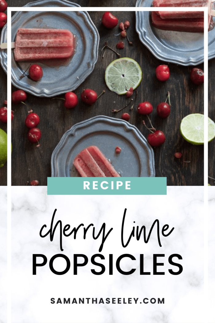 cherry lime popsicles on plates with cherries and limes