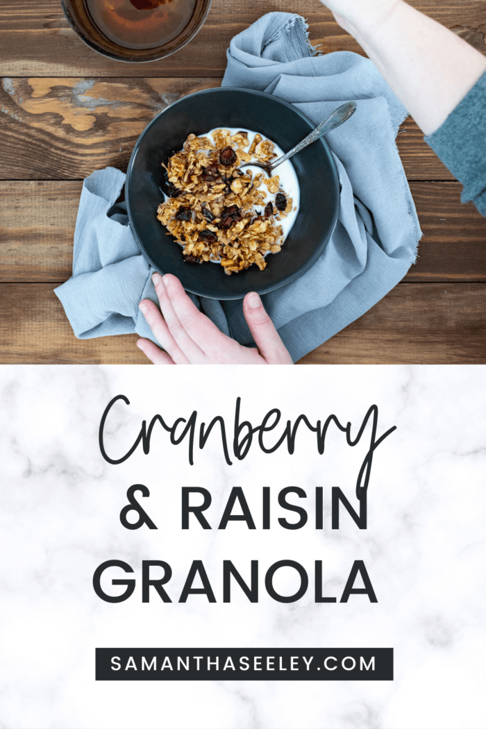bowl of granola with milk and hands preparing with honey