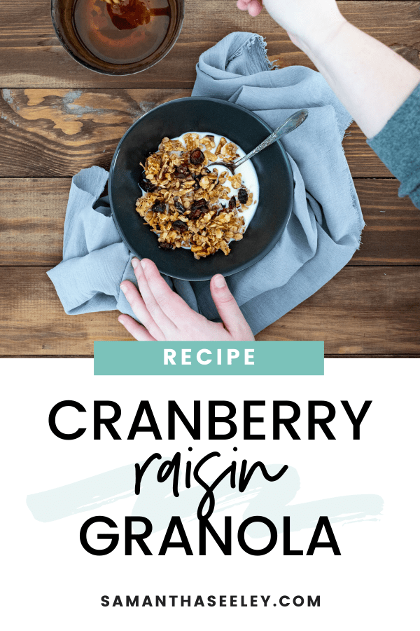 bowl of granola with milk and hands preparing with honey