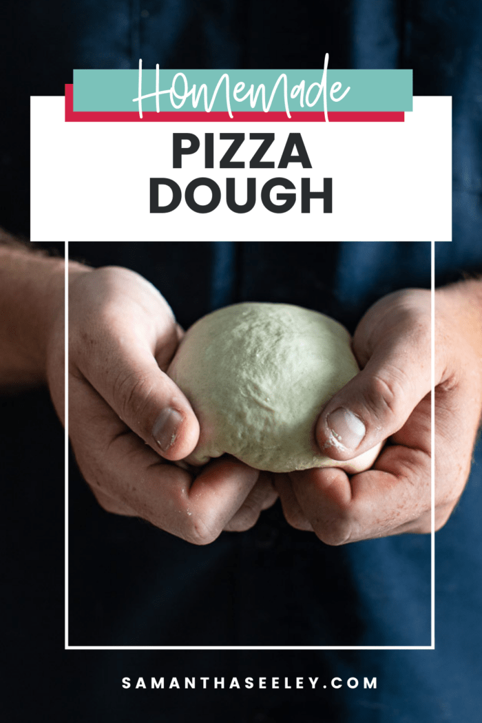 hands holding pizza dough