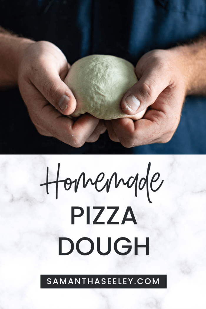 hands holding pizza dough